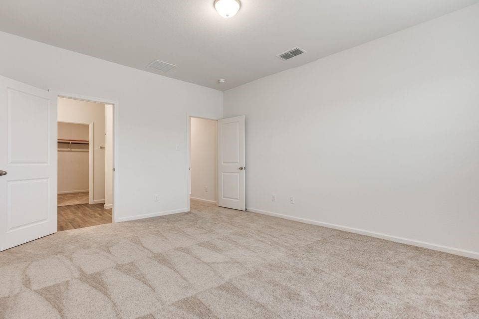 212 Briar Cove, Anna, TX 75409 Expansive room with neutral carpeting, white walls, and a ceiling-mounted light fixture