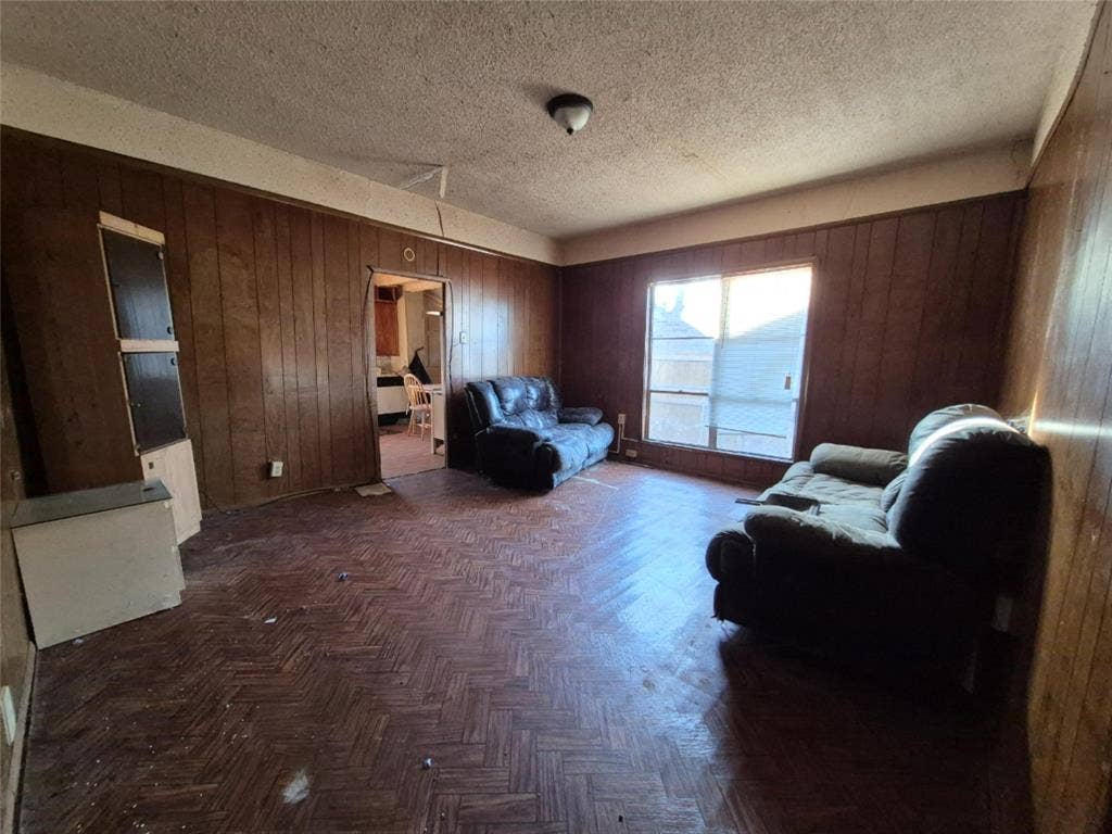 Wood-paneled walls and a wood-finish herringbone floor