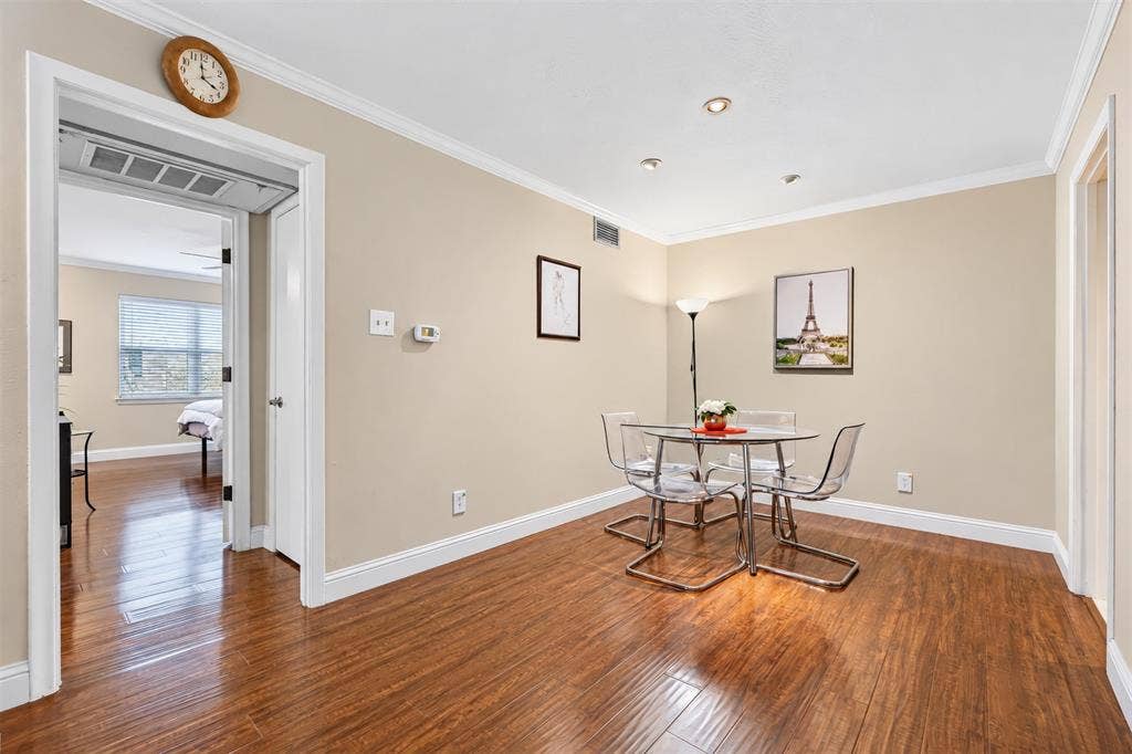 5005 Cedar Springs Road, #A, Dallas, TX 75235 Wood-finish flooring throughout, crown molding, recessed lighting, and a neutral color palette