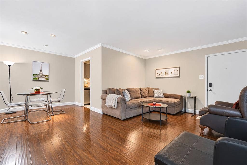 5005 Cedar Springs Road, #A, Dallas, TX 75235 Recessed lighting illuminates the open-concept living space, featuring wood-finish flooring and crown molding