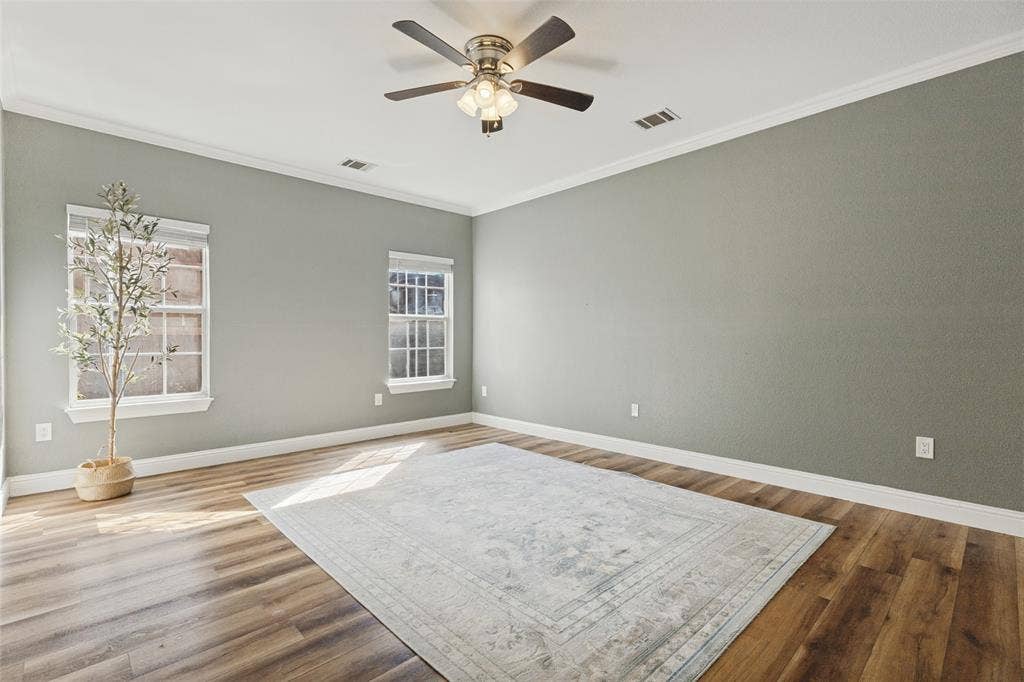 Oversized primary bedroom right off the living room with great natural lighting