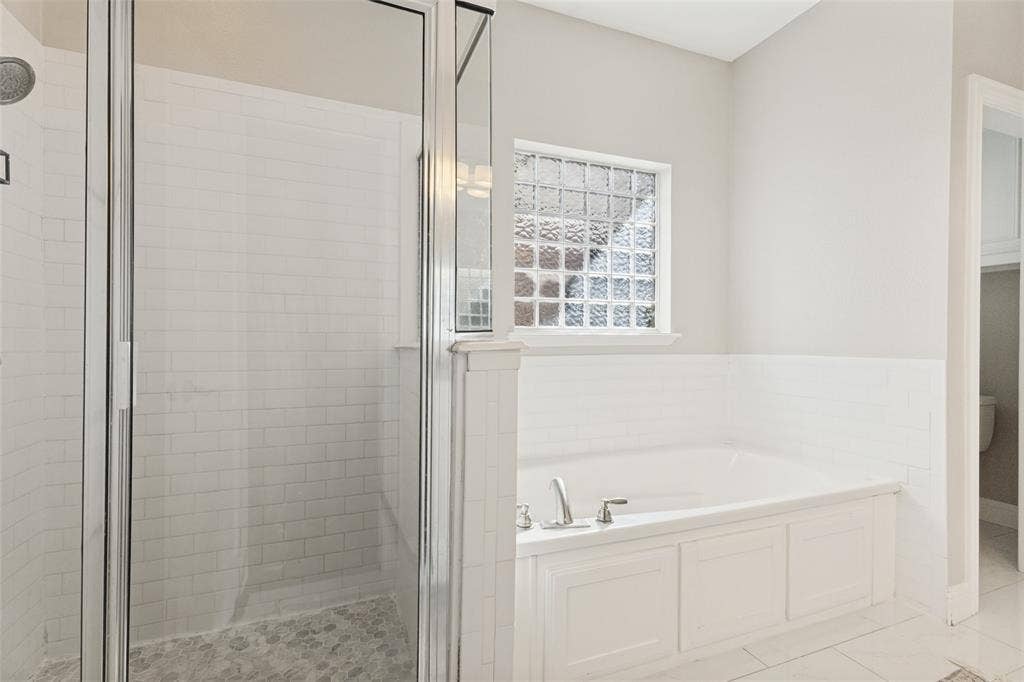 Primary bathroom with both shower and bathtub