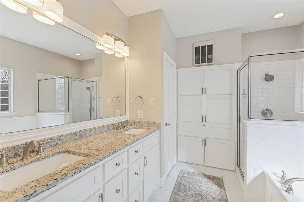 Large primary bathroom with dual sinks