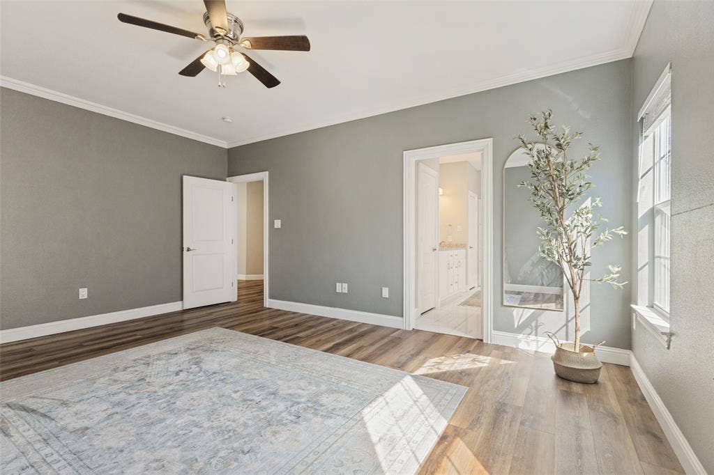 Oversized primary bedroom right off the living room with great natural lighting