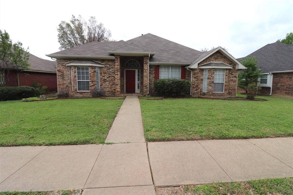 2222 Edinburgh Way, Garland, TX 75040 Brick exterior with multiple gables and a covered entry