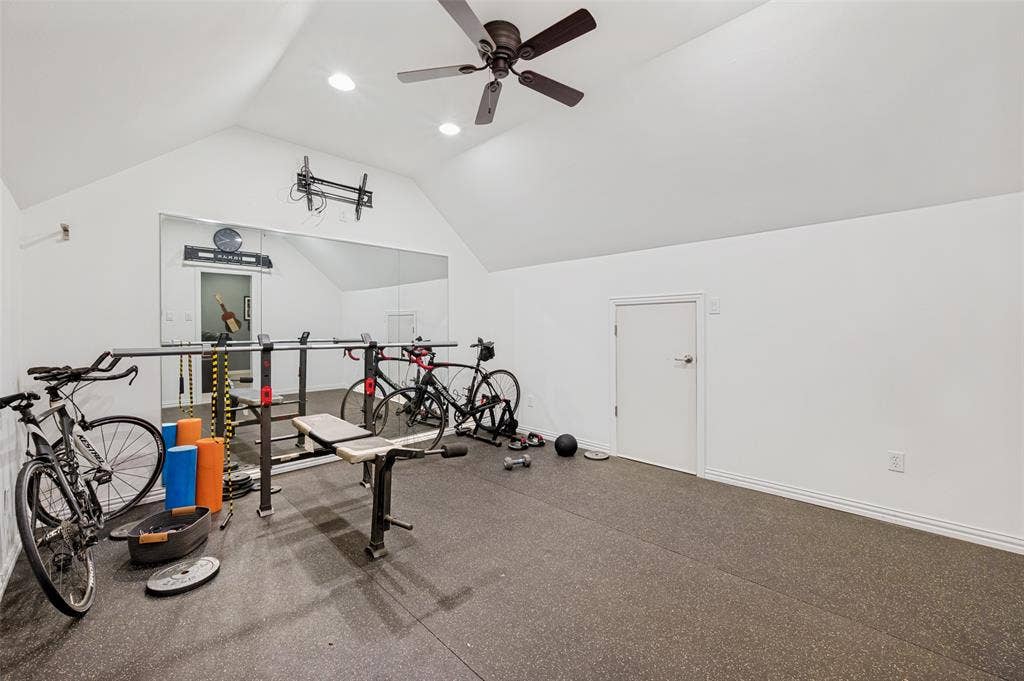 131 Darian Drive, Prosper, TX 75078 Vaulted ceiling with recessed lighting, ceiling fan, full-height wall mirror, and dedicated access door