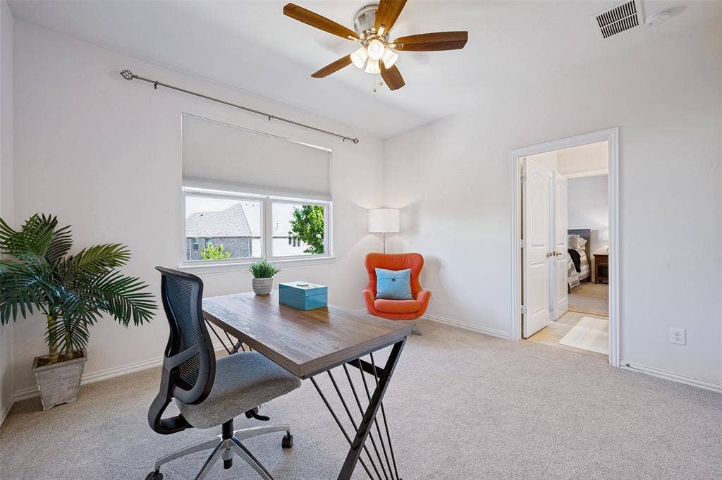 131 Darian Drive, Prosper, TX 75078 Room with neutral carpeting, multi-pane window with roller shade, ceiling fan with integrated lighting, and white interior doors