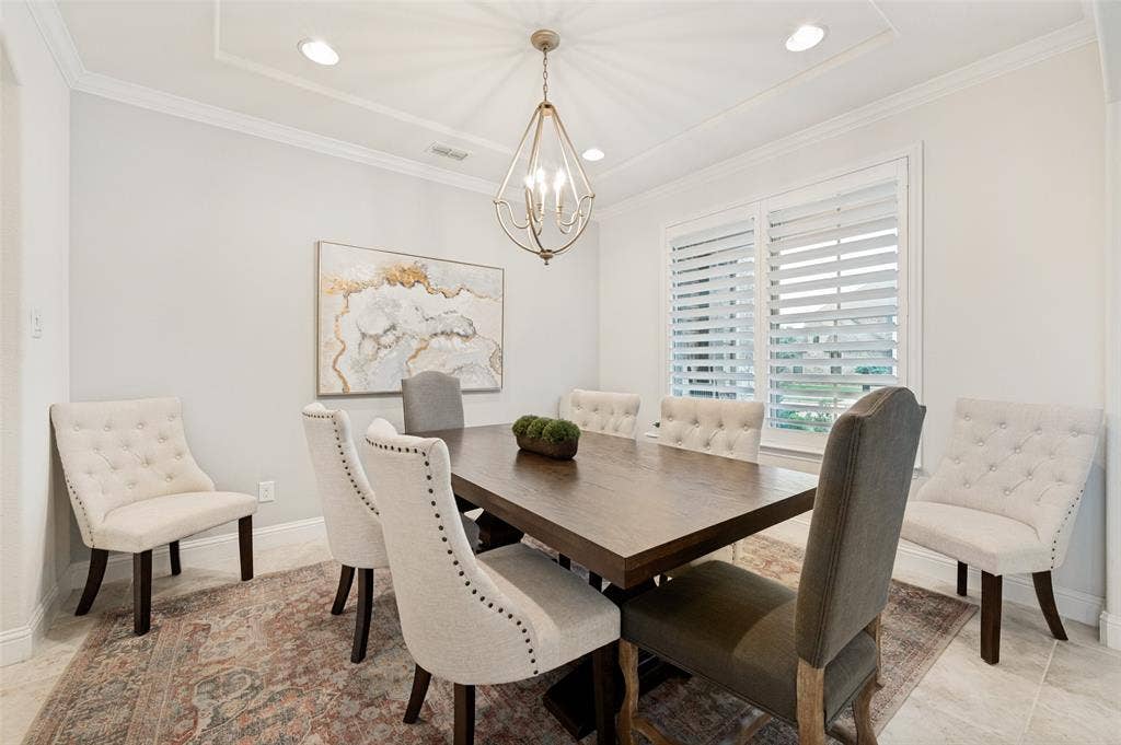 131 Darian Drive, Prosper, TX 75078 Tray ceiling with recessed lighting, crown molding, plantation shutters, and tile flooring
