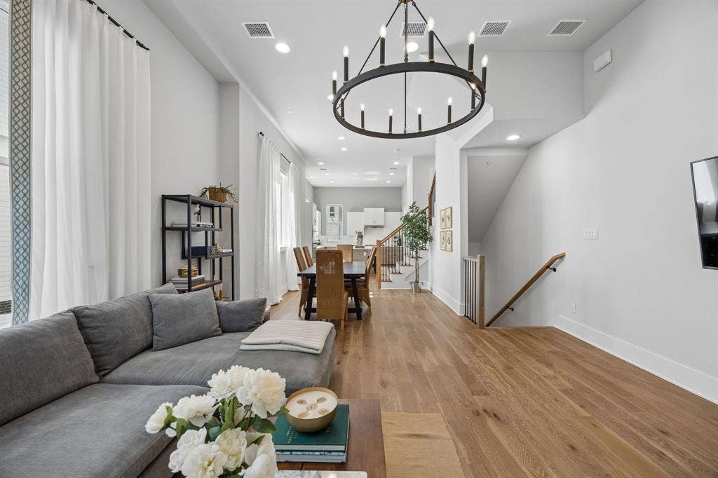 381 E Greenbriar Lane, #1001, Dallas, TX 75203 Second floor features 12-foot ceilings anchored by luxurious engineered hardwoods and a floorplan that makes this feel like a home.