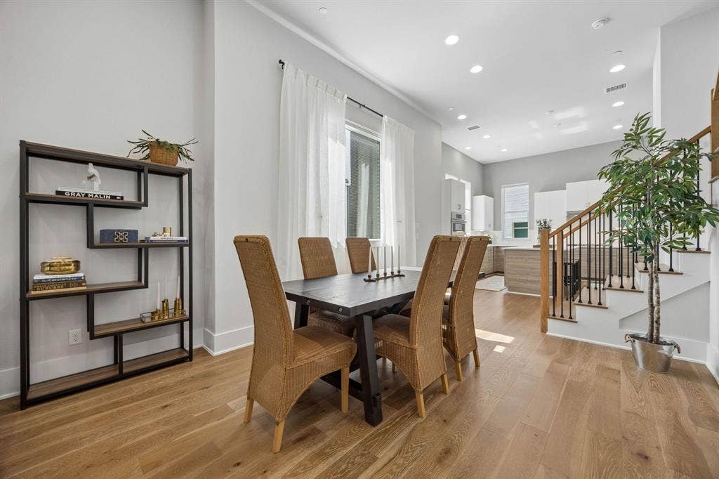 381 E Greenbriar Lane, #1001, Dallas, TX 75203 Generous space between the living room and kitchen allows for a larger dinner parties if desired.