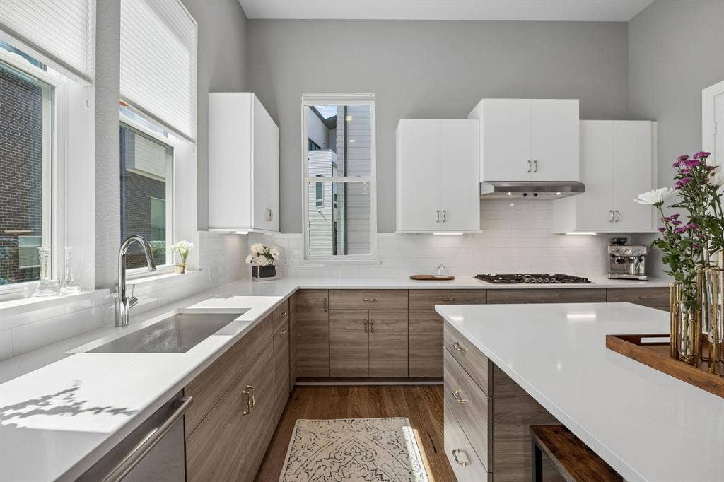 381 E Greenbriar Lane, #1001, Dallas, TX 75203 Island allows for sitting and gathering, and additional space for a beverage fridge