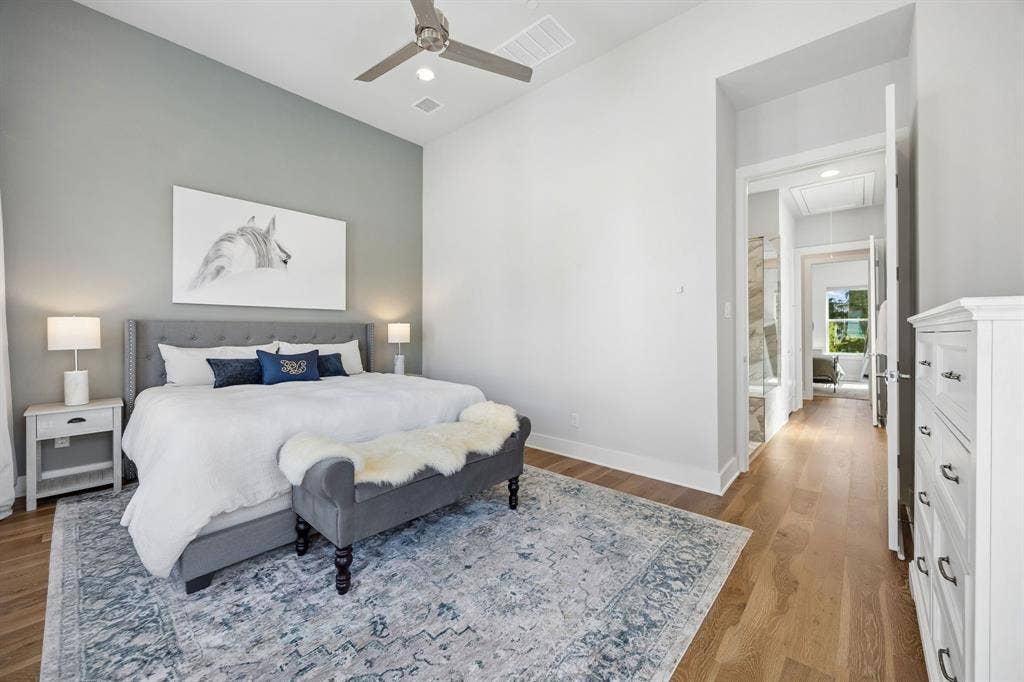 381 E Greenbriar Lane, #1001, Dallas, TX 75203 A long hallway with closet and ensuite provides added privacy between the Primary and Secondary Bedroom Suites.