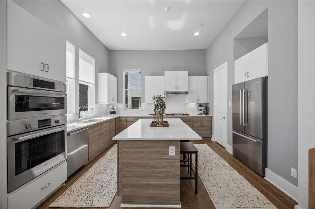 381 E Greenbriar Lane, #1001, Dallas, TX 75203 The kitchen features an abundance of storage, dedicated pantry, high ceilings filled with natural light