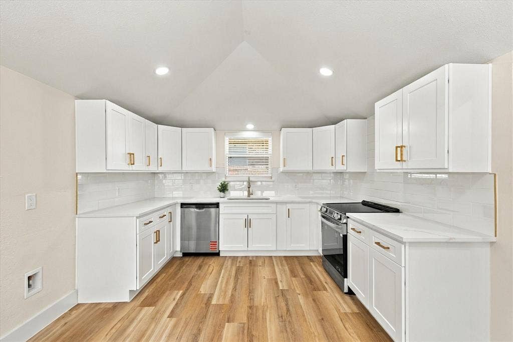 Wood-finish flooring throughout, recessed ceiling lighting, a contemporary ceiling fan, and a curved bay window
