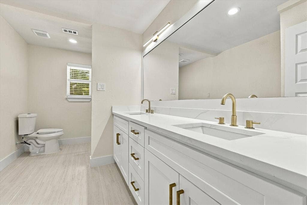 Plush carpeting, recessed lighting, and a contemporary ceiling fan with integrated lighting