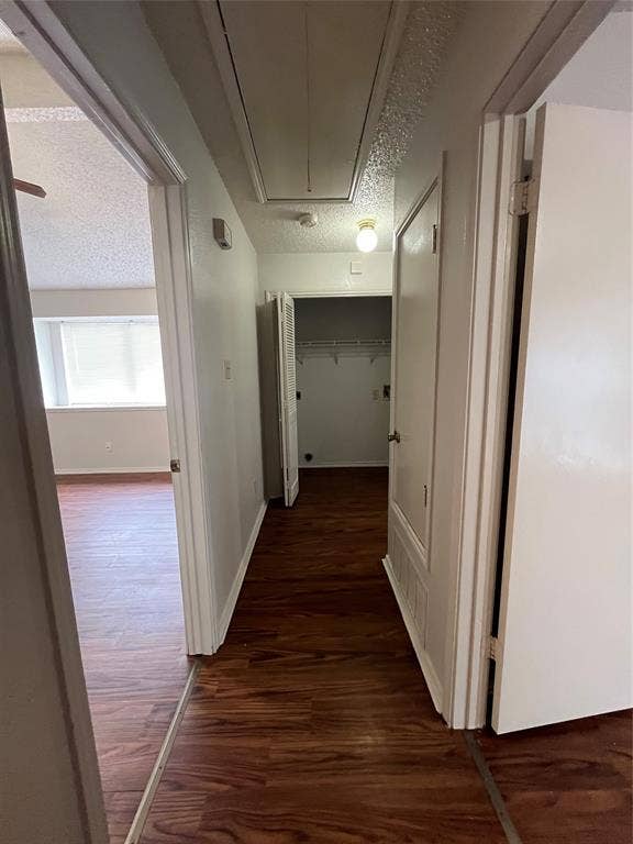 724 Ballard Street, Cedar Hill, TX 75104 Hallway with dark hardwood / wood-style floors and a textured ceiling