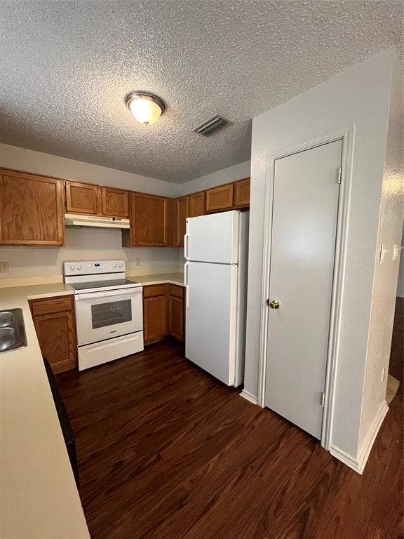 724 Ballard Street, Cedar Hill, TX 75104 Kitchen featuring extractor fan, dark hardwood / wood-style flooring, white refrigerator, and stove