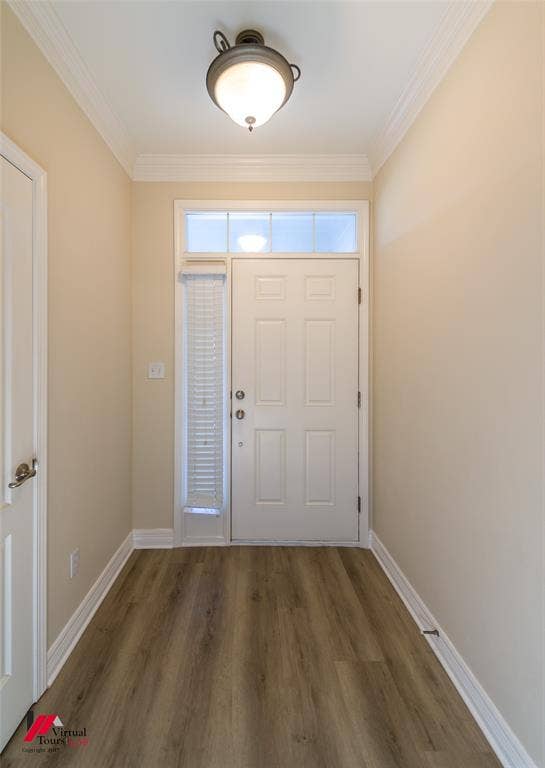 Entryway featuring wood-finish flooring, crown molding, a semi-flush mount ceiling fixture, and a six-panel door with a sidelight and transom window