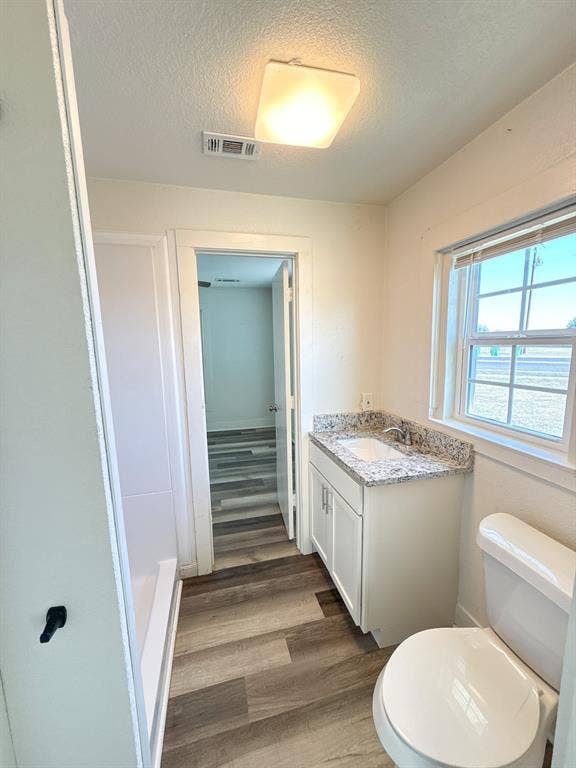 150 Fm 1996, Oglesby, TX 76561 Jack and Jill bathroom with walk-in shower, granite counter tops, and built in cabinets