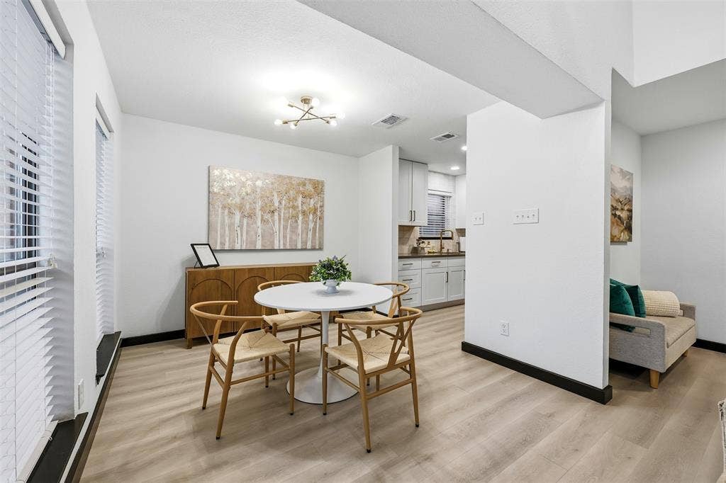 Recessed lighting, wood-finish flooring, white walls, white window blinds, and a contemporary ceiling fixture