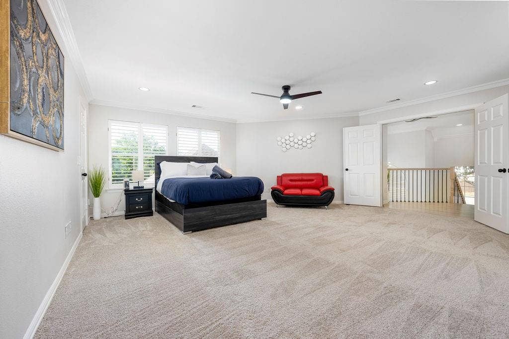 2007 Hill Haven Circle, Richardson, TX 75081 Expansive room featuring light-toned carpeting, ceiling fan with integrated lighting, and multiple windows with plantation shutters
