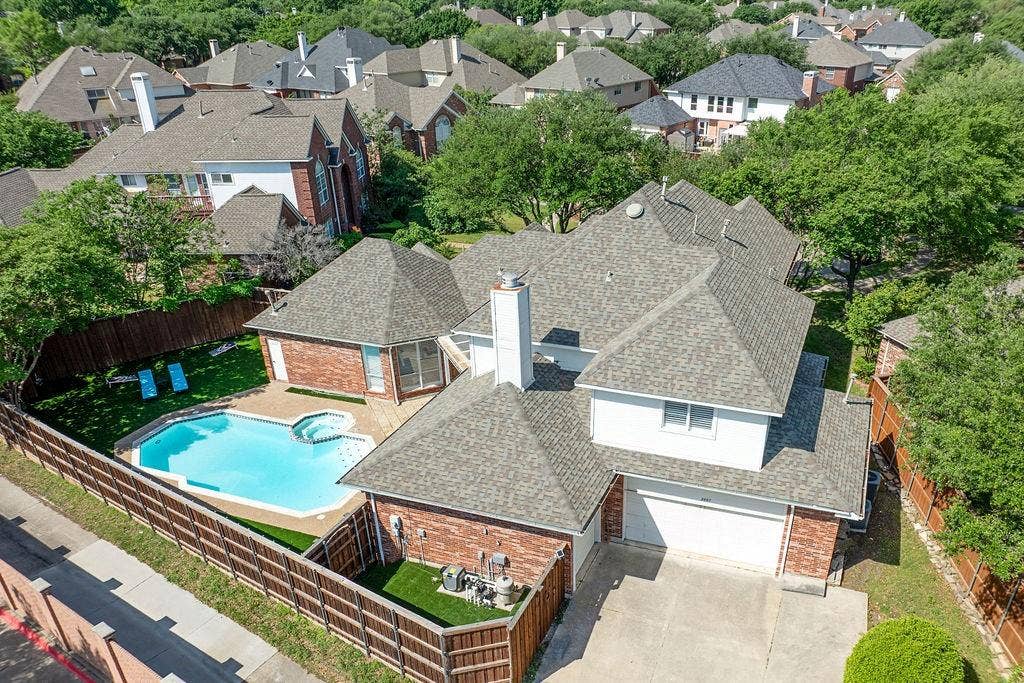 2007 Hill Haven Circle, Richardson, TX 75081 Brick exterior with white siding accents and a multi-level shingle roof