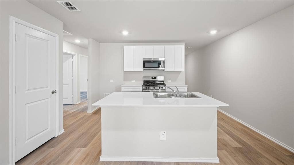 Kitchen-All Home and community information, including pricing, included features, terms, availability and amenities, are subject to change at any time without notice or obligation. All Drawings, pictures, photographs, video, square footages, floor plans, elevations, features, colors and sizes are approximate for illustration purposes only and will vary from the homes as built.