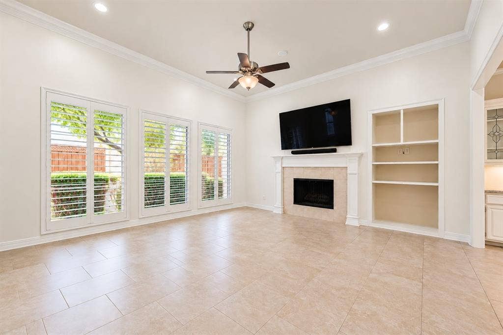 4612 Saxon Drive, Plano, TX 75093 Spacious living area featuring high ceilings, recessed lighting, and a tile floor