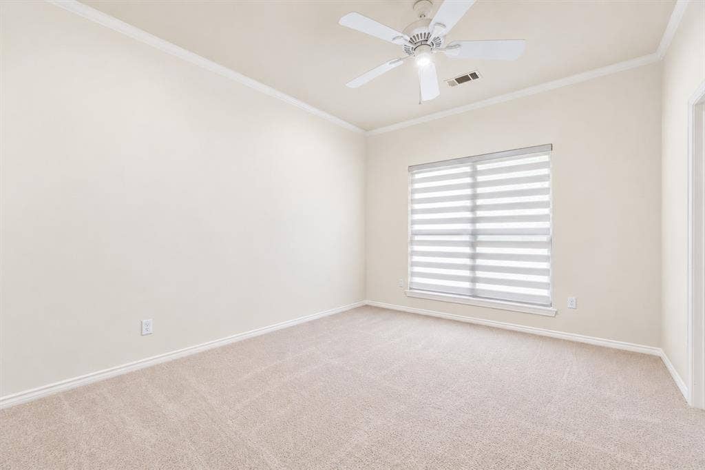 4612 Saxon Drive, Plano, TX 75093 Neutral wall color, crown molding, ceiling fan, window with horizontal blinds, and carpeted flooring