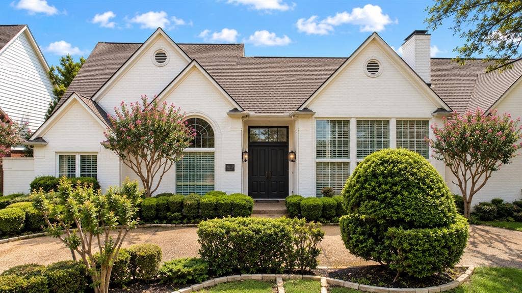4612 Saxon Drive, Plano, TX 75093 White brick exterior with dark shingle roofing