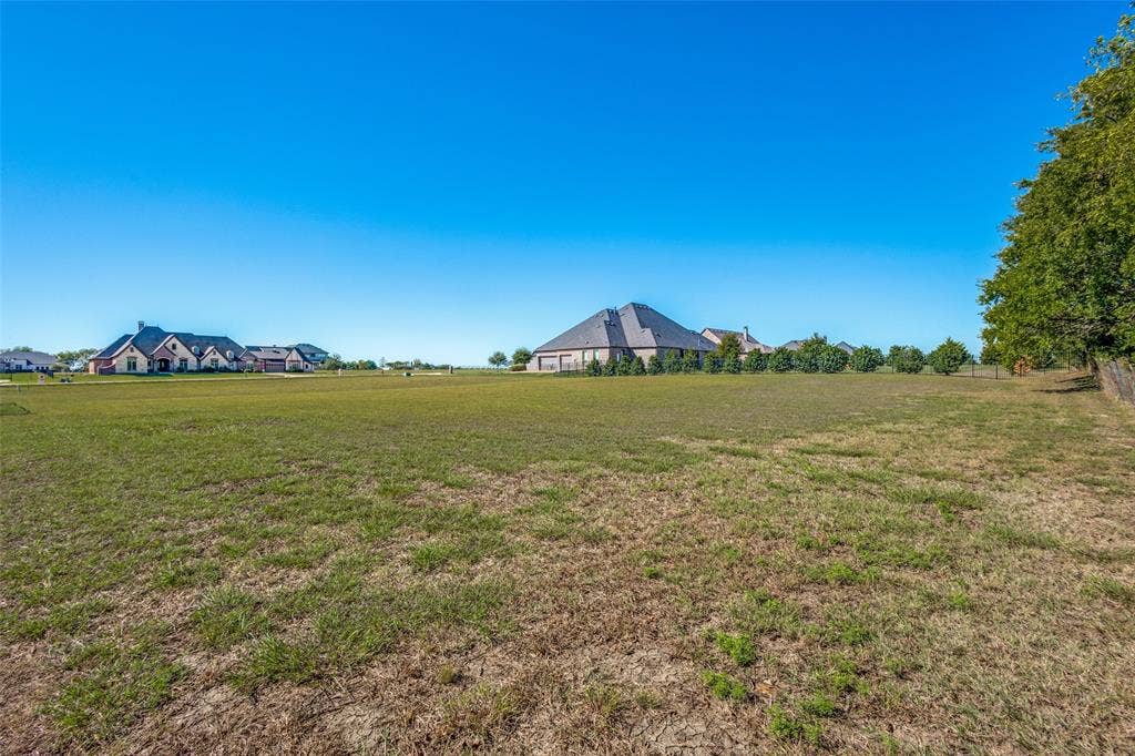 C-14 Waterstone Estates, McKinney, TX 75071 Expansive level lot with established perimeter trees and partially visible fencing