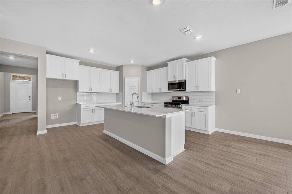 Kitchen - All Home and community information, including pricing, included features, terms, availability and amenities, are subject to change at any time without notice or obligation. All Drawings, pictures, photographs, video, square footages, floor plans, elevations, features, colors and sizes are approximate for illustration purposes only and will vary from the homes as built.