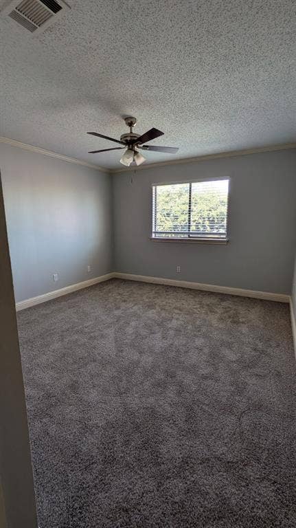 Recessed window, ceiling fan with integrated lighting, textured ceiling, and crown molding