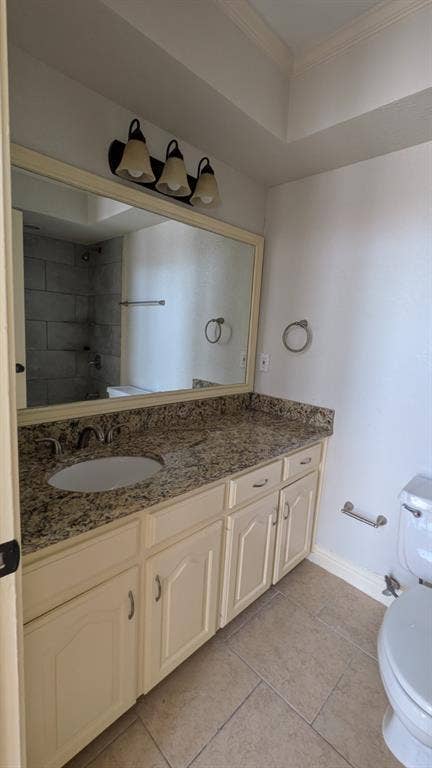 Extended vanity with a stone countertop, under-mount sink, and three-light fixture