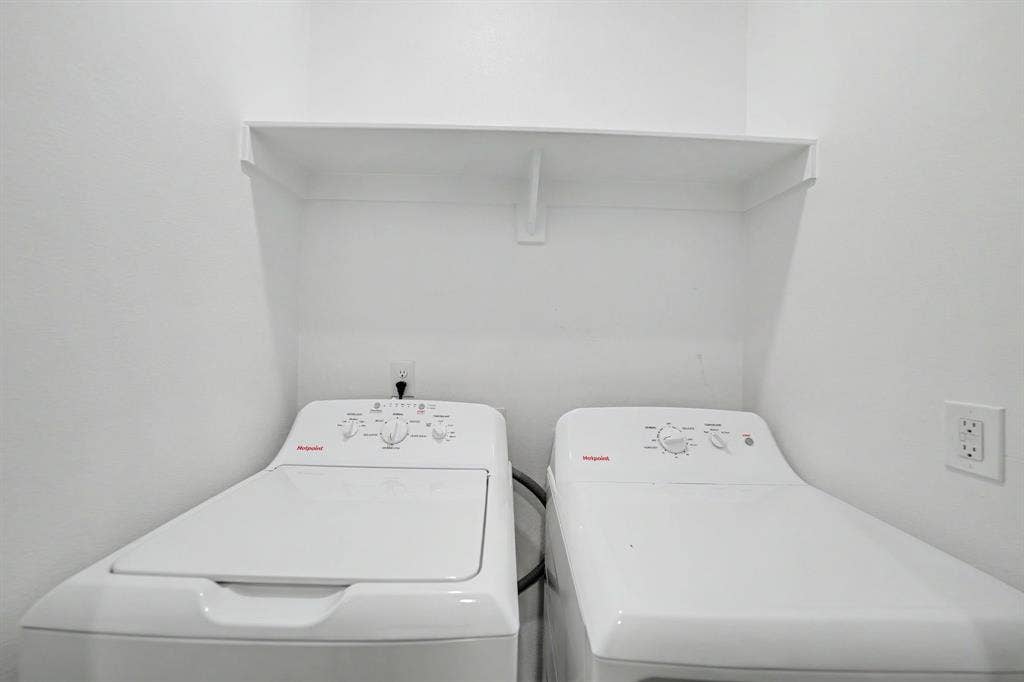 Laundry area with a built-in white shelf