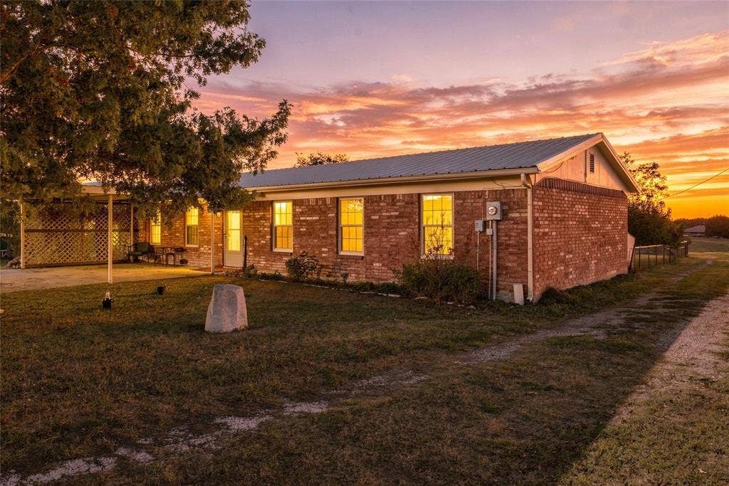 560 Green Acres Road, Weatherford, TX 76088 Brick exterior with a metal roof