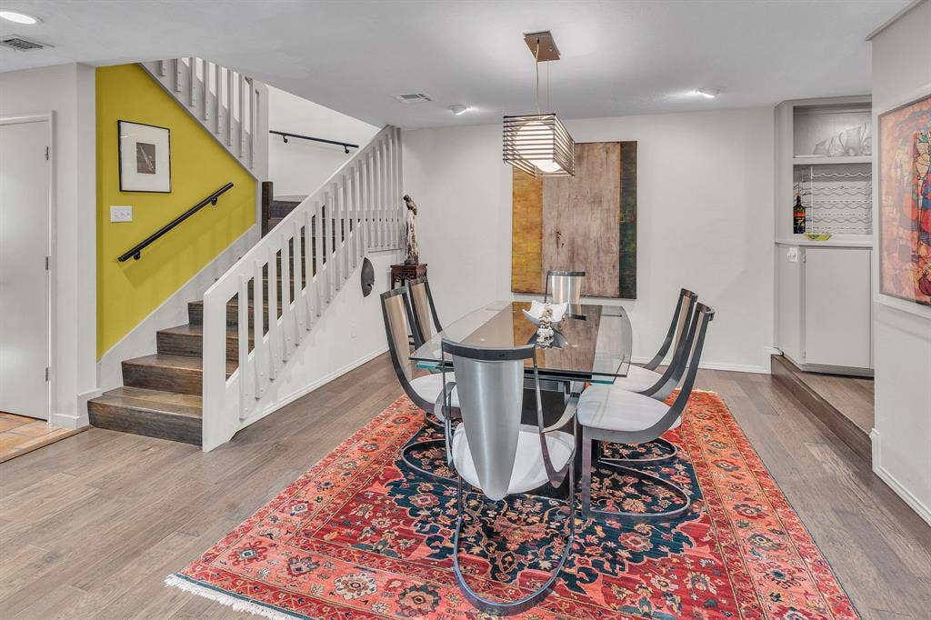 Dining area with refined light fixture