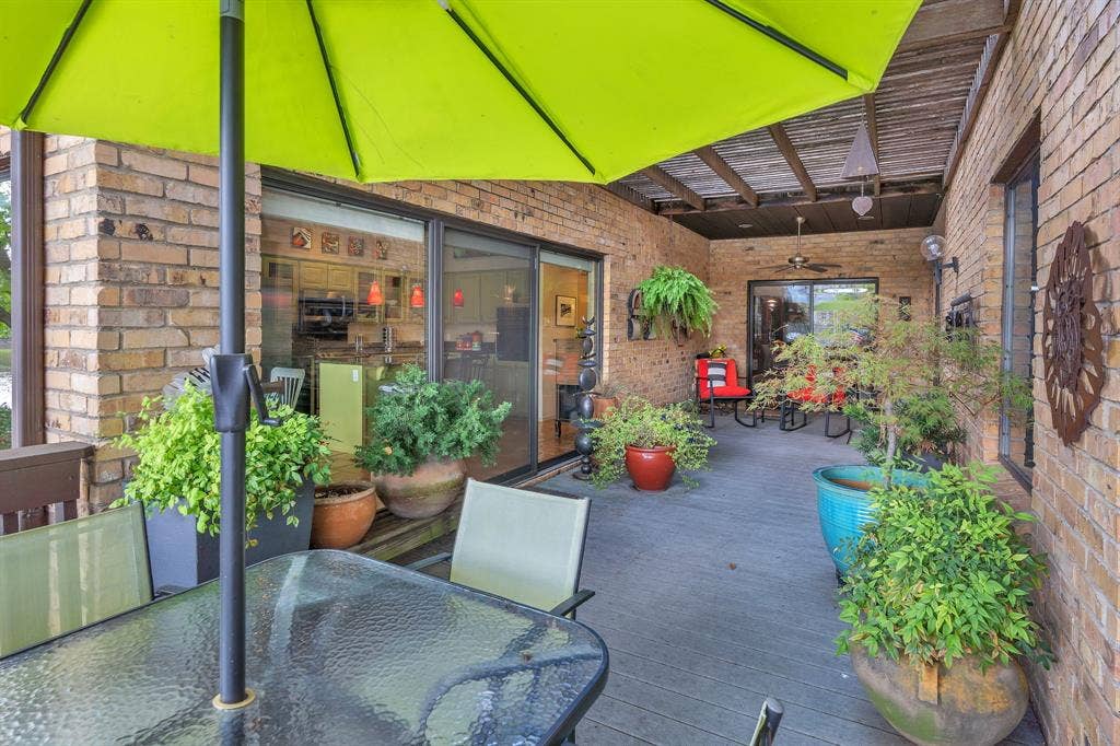 Patio with many doorways and windows to view this serene area with nature