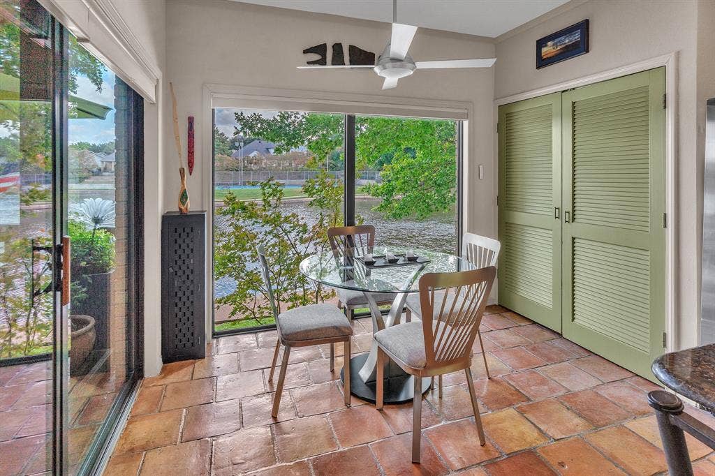 WOW all the windows and doorways to view the lake from the breakfast room and kitchen