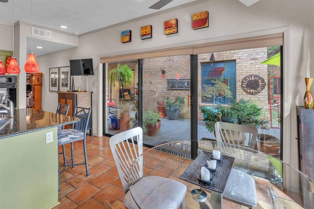 Sliding door to cozy patio with a view of the lake