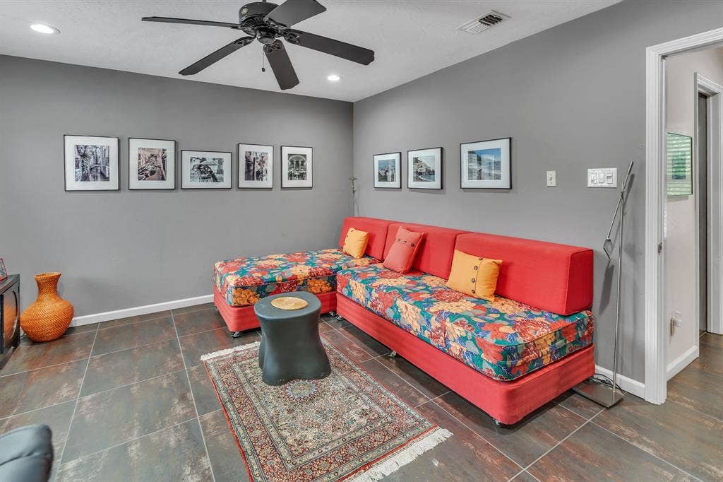Upstairs bedroom with ceramic tile flooring and recessed lights