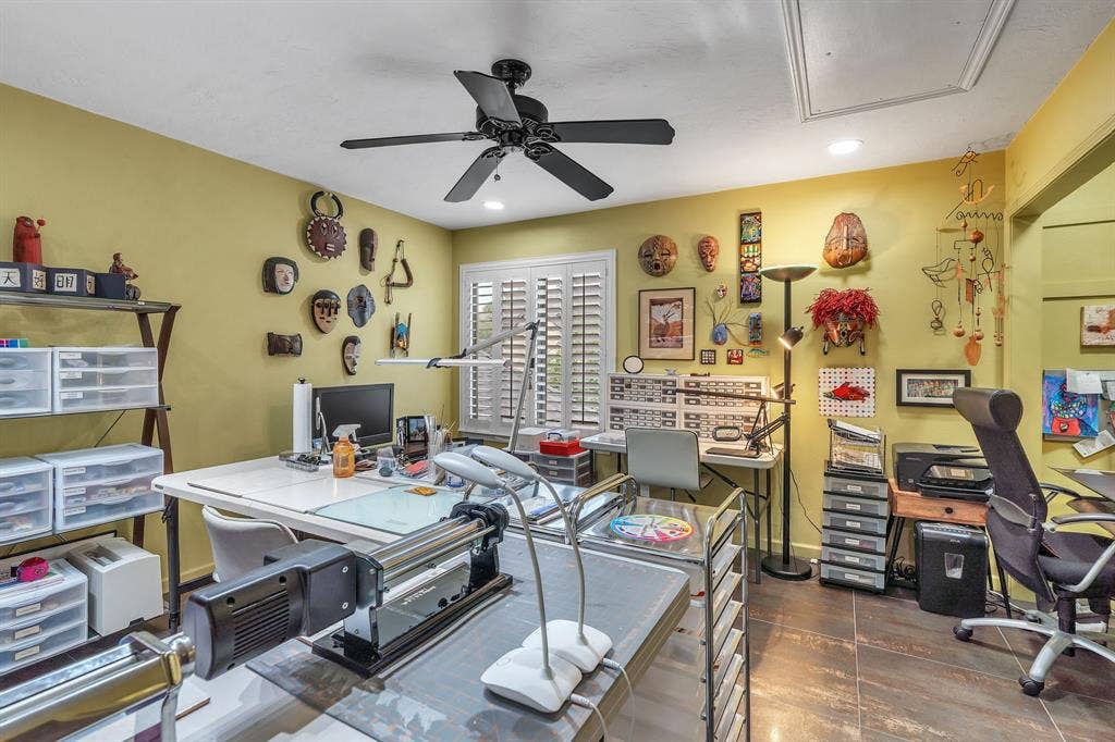 Upstairs bedroom with large window for natural light. Plantation shutters