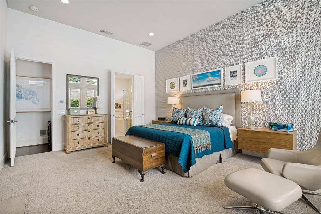 5904 Kensington Drive, Plano, TX 75093 The primary suite...private with a warm ambiance.