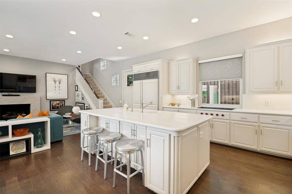 5904 Kensington Drive, Plano, TX 75093 Storage on both sides of the island AND seating!