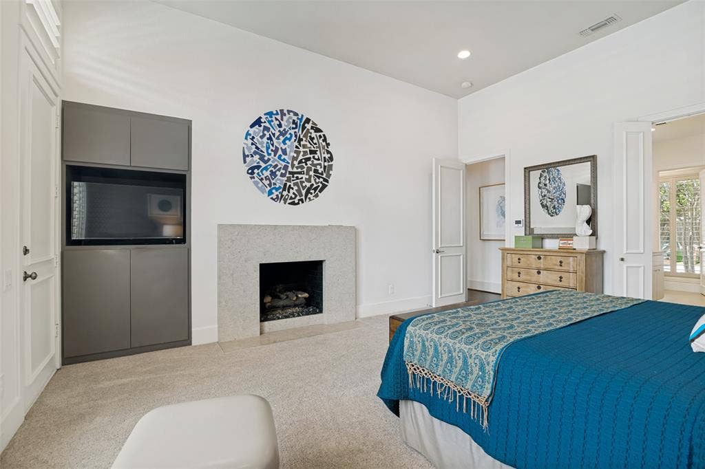 5904 Kensington Drive, Plano, TX 75093 Fireplace adds a cozy feel to this suite.