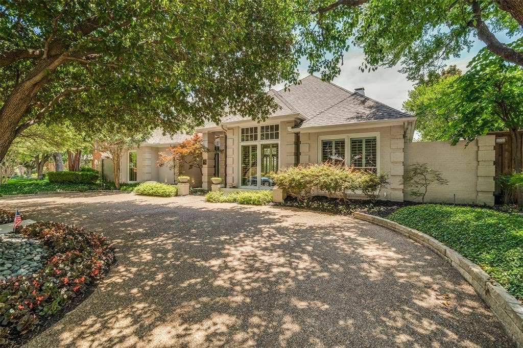 5904 Kensington Drive, Plano, TX 75093 Outstanding first impression with wide circular drive and pretty, colorful landscaping.