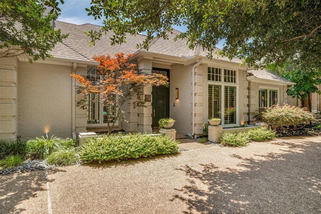 5904 Kensington Drive, Plano, TX 75093 Gorgeous Japanese Maple is a standout pop of color against the light brick exterior.