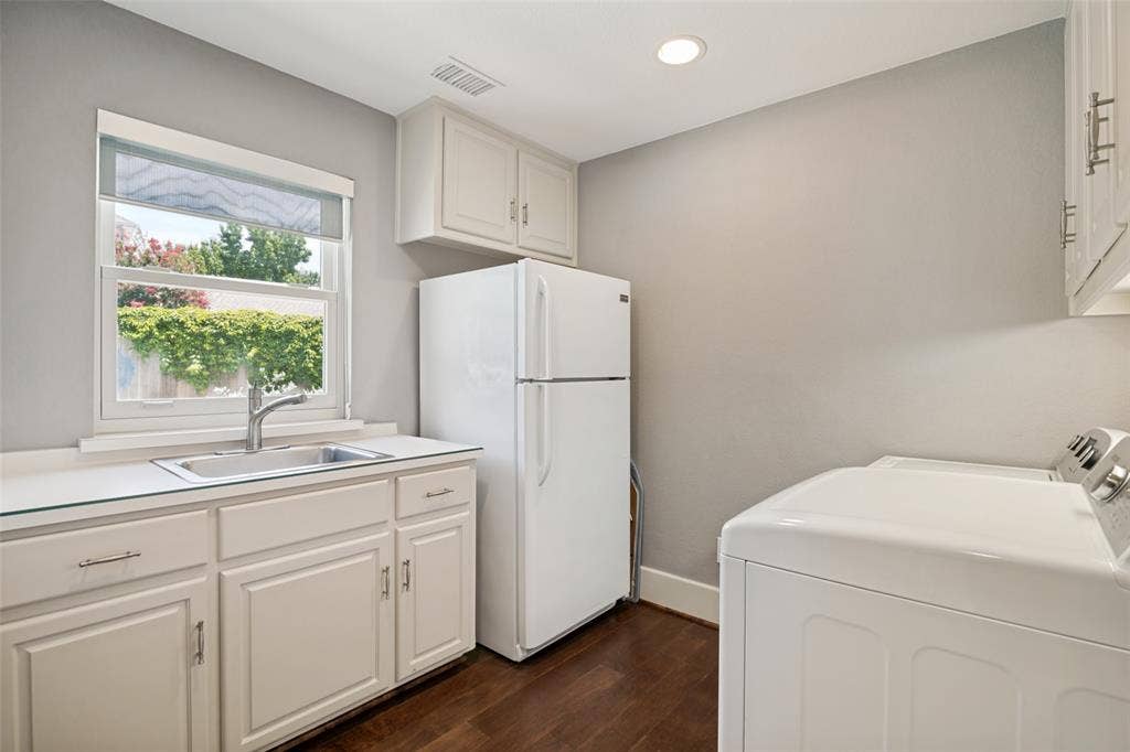 5904 Kensington Drive, Plano, TX 75093 Light, bright laundry room with sink, room for fridge and cabinets.