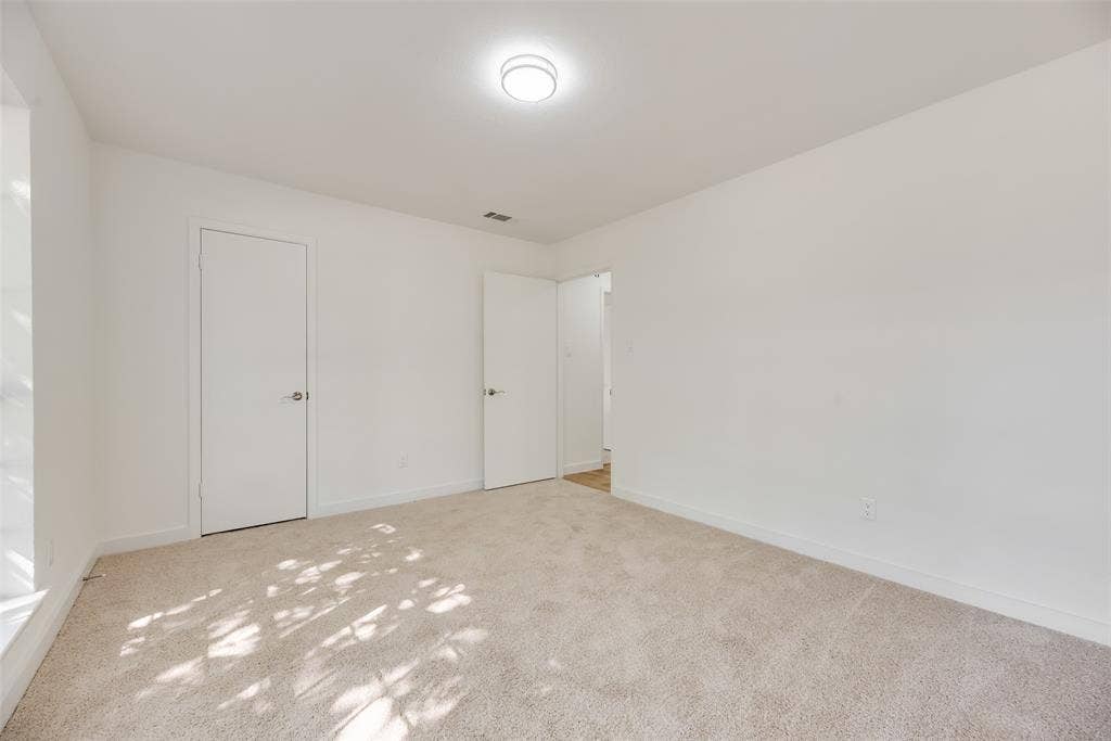 1903 Clemson Drive, Richardson, TX 75081 Carpeted flooring, white painted walls, and a flush mount ceiling light