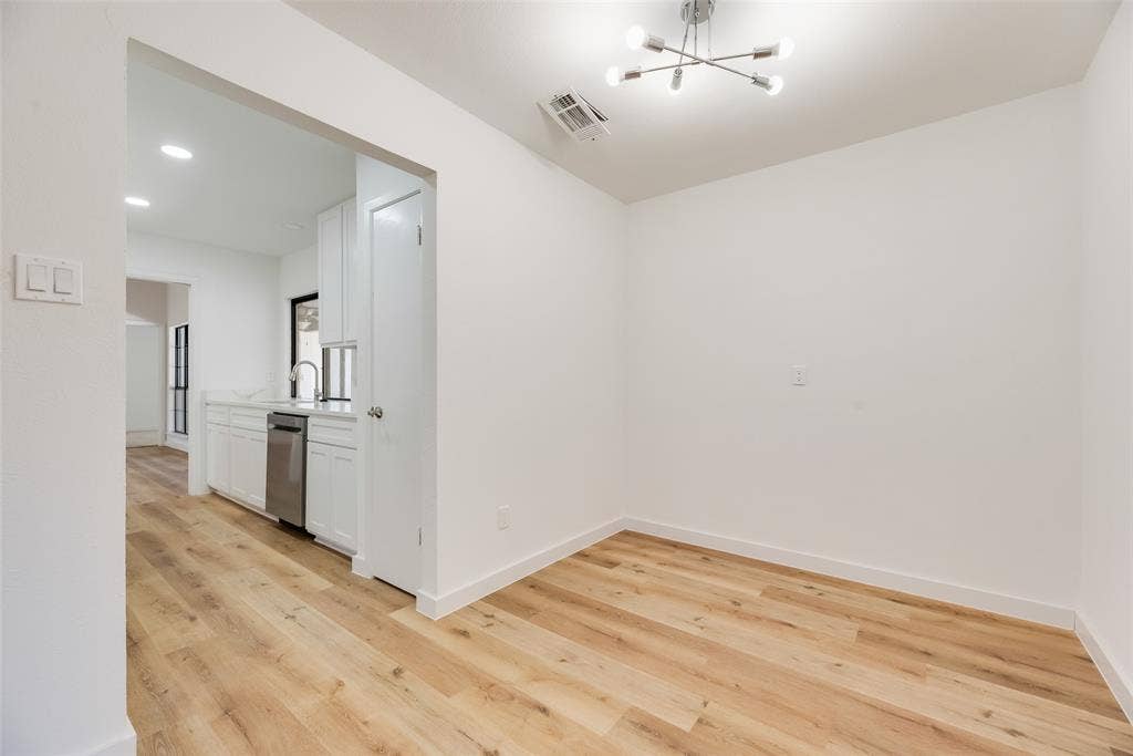 1903 Clemson Drive, Richardson, TX 75081 Wood-finish flooring throughout, with a contemporary ceiling fixture and recessed lighting